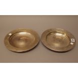 Two silver circular dishes, each presentation inscribed, modern dates, both 25.
