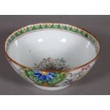 A Chinese famille rose bowl, early 20th century, painted with panels enclosing baskets of flowers,