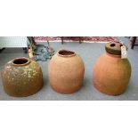 Three 20th century terracotta rhubarb forcers, each approx 40cm high, (3).