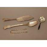 Silver, comprising; a King's pattern double struck stuffing spoon, the hallmark rubbed,