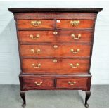 A mid-18th century mahogany chest of two short and three long graduated drawers on associated two