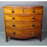 A George III mahogany and ebony strung bowfront chest of two short and three long graduated drawers