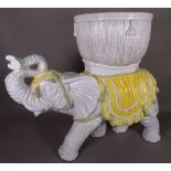 A 20th century ceramic jardiniere formed as an elephant, 75cm wide x 63cm high.