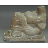 A Henry Moore style stone figure group depicting an embracing couple, unsigned, 26cm wide.