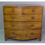 A George III mahogany bowfront chest of two short and three long graduated drawers on bracket feet,