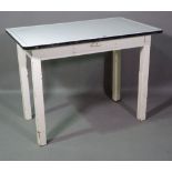 A 20th century white painted rectangular side table with white enamel top on square block supports,