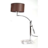 An adjustable chrome table lamp on a rectangular white marble base, approx, 70cm high.