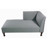 A grey upholstered day bed on tapering square supports, 150cm wide x 72cm high.