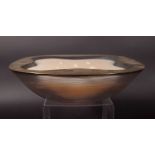 Lalique; a rounded square 'Stresa' bowl of ribbed tapering form, with gilt decorated rim, 30cm wide.