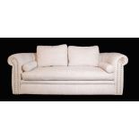A Chesterfield sofa with white studded cotton upholstery on block feet, 223cm wide x 79cm deep.