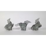 Lalique; a group of three smoked glass models of horses, the largest 12cm high.