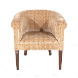 A hardwood framed tub chair with beige upholstery on tapering square supports, 67cm wide.
