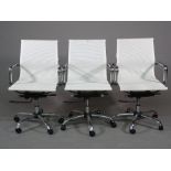 A set of three chrome and white canvas adjustable office chairs, 58cm wide, (3).