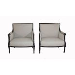 A pair of ebonised Louis XVI style armchairs on fluted tapering supports, 80cm wide x 90cm high.