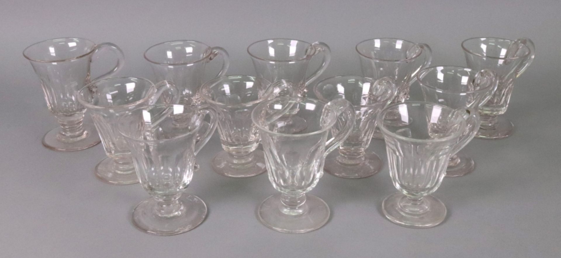 A collection of twelve facet cut glass custard cups, late 19th/early 20th century,