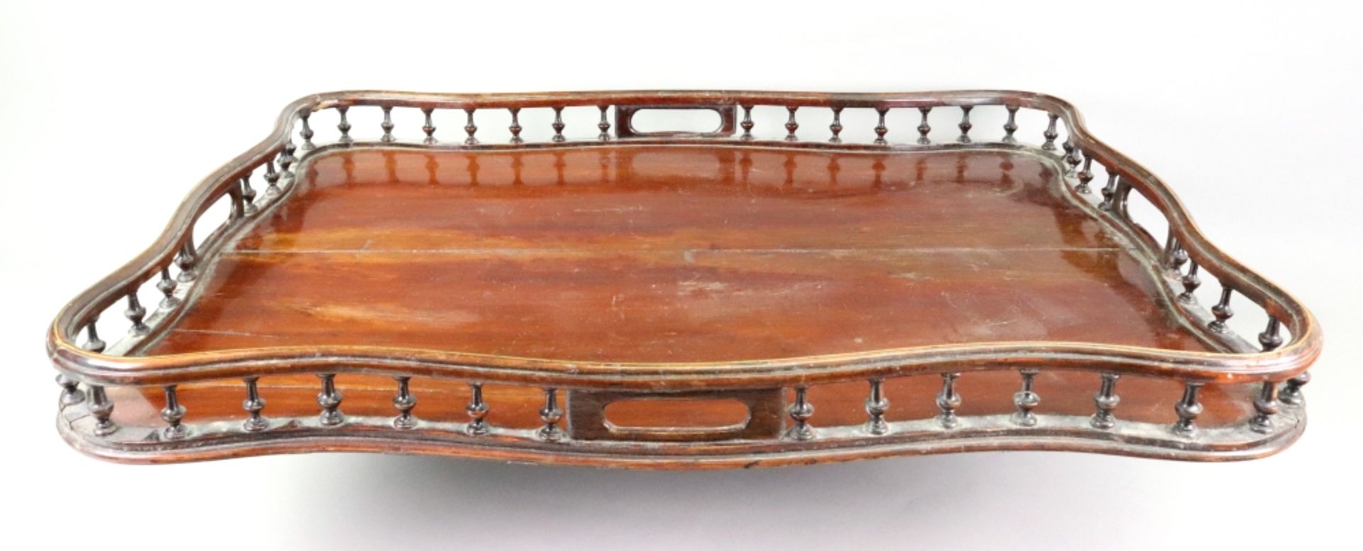 A George III style mahogany tray, 19th century, of serpentine outline,