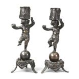 A pair of bronze candlesticks.