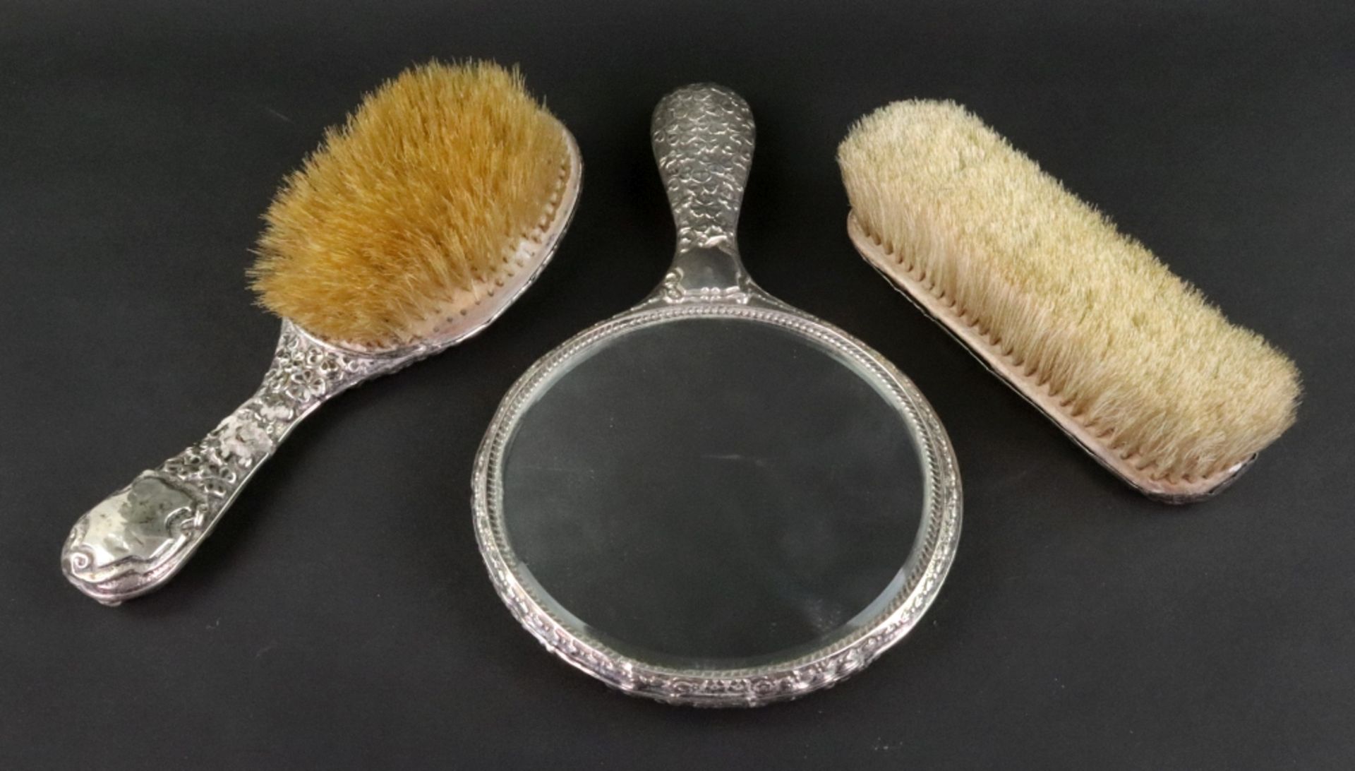 A silver mounted hand mirror, hair and clothes brushes, Nathan & Hayes, circa 1910, - Image 2 of 2