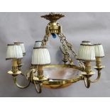 A French gilt metal eight light chandelier, early 20th century, with domed circular alabaster shade,
