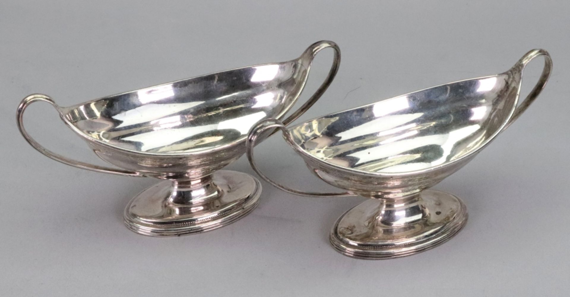 A pair of George III oval silver salt cellars, Charles Hougham, London 1790,