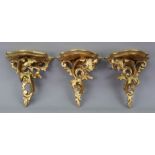 A pair of Florentine giltwood wall brackets, 20th century, leafy scroll carved and pierced,