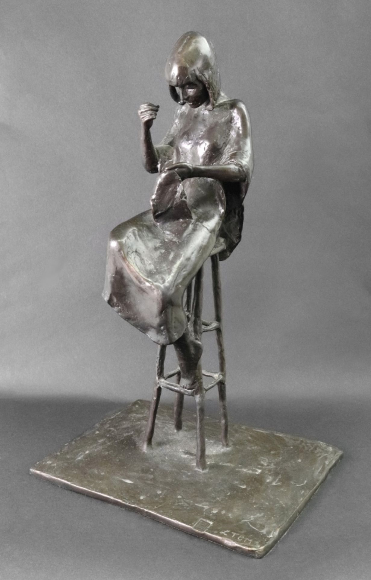 L T C M (British, 20th Century) A seated woman sewing,