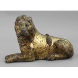 A gilt painted cast iron figure of a seated lion, 19th century, 19cm wide x 13cm high.