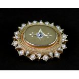 A Victorian gilt-metal, half-pearl and small old-cut diamond oval brooch, approximately 33mm wide,