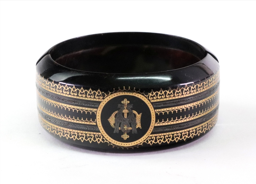 A Victorian tortoiseshell pique broad hinged bangle, currently in two pieces,