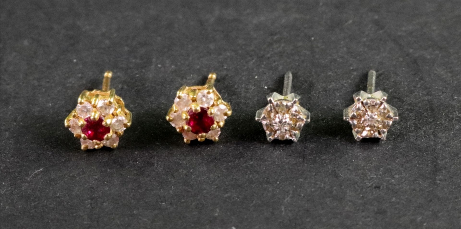 Two pairs of 18ct gold and gem set stud earrings, comprising; a pair of yellow gold,