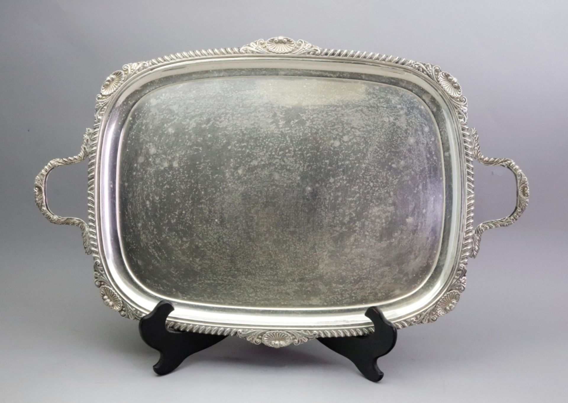 A George IV style silver two handled tea tray, William Hutton & Sons, London 1908, with shell,