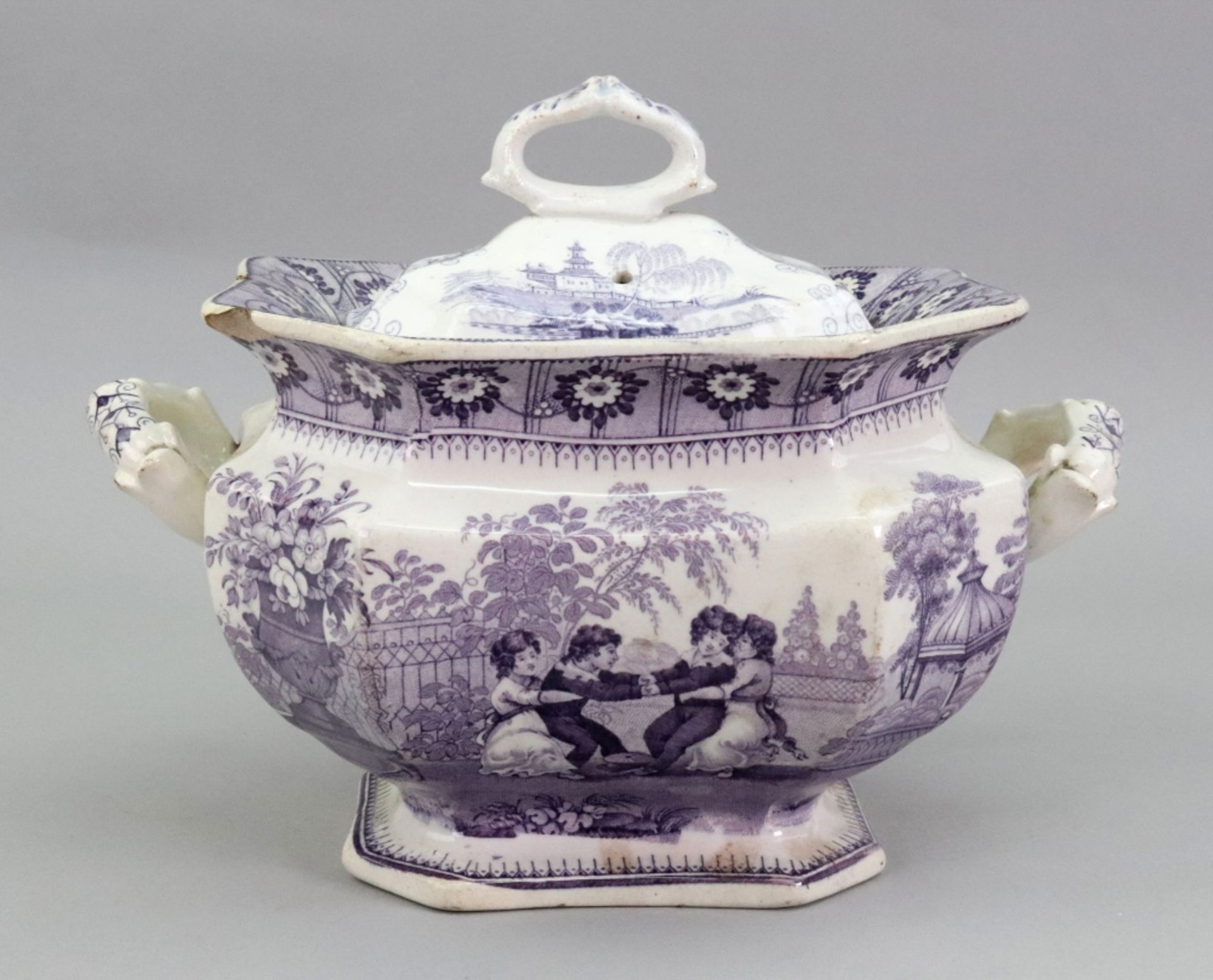 An English pottery two handed sauce tureen, circa 1830, of shaped outline,