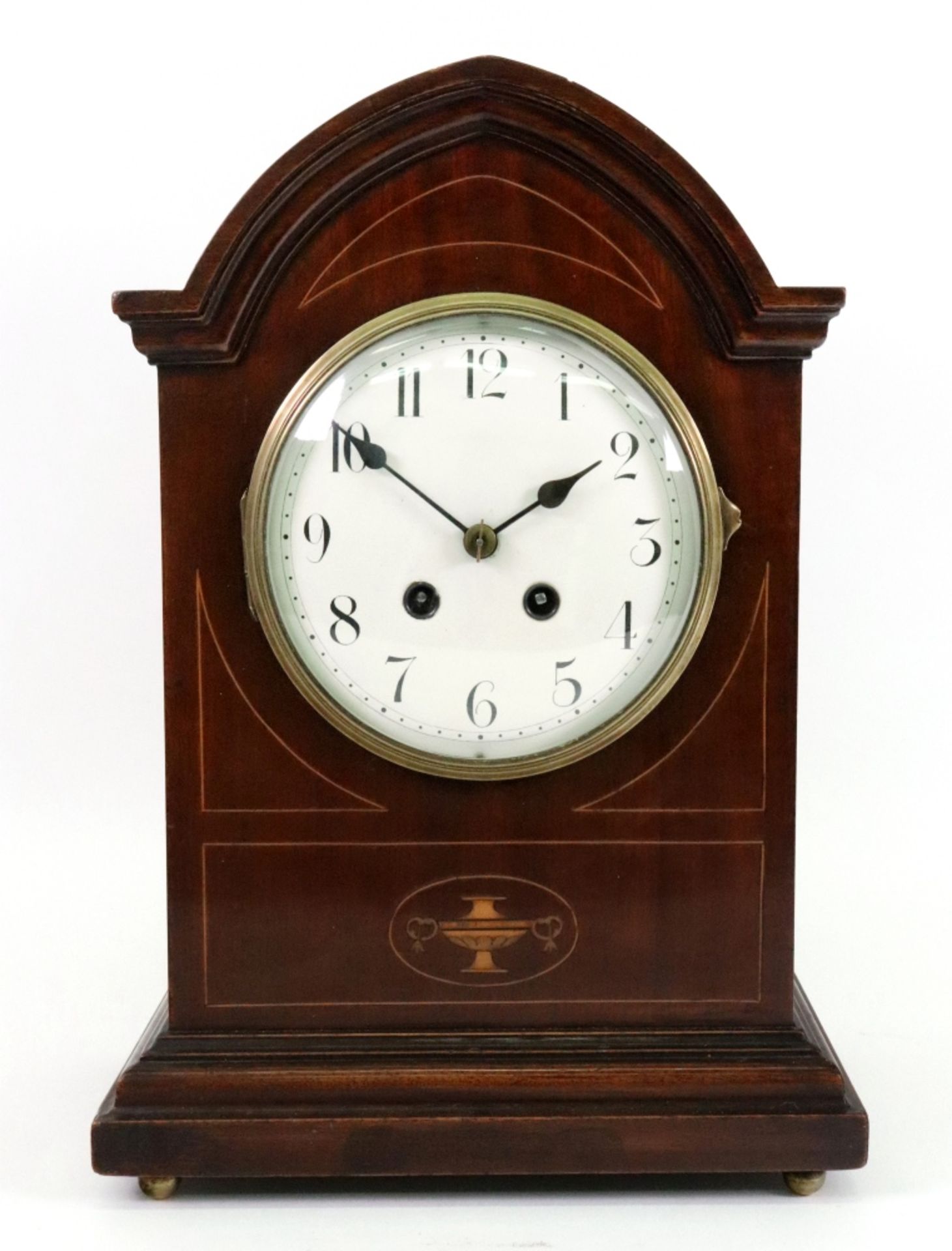 An Edwardian mahogany boxwood strung 'Sheraton Revival' mantel clock, with arched top case,