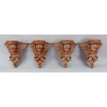 A set of four Italian pine stained as walnut wall brackets, 20th century,