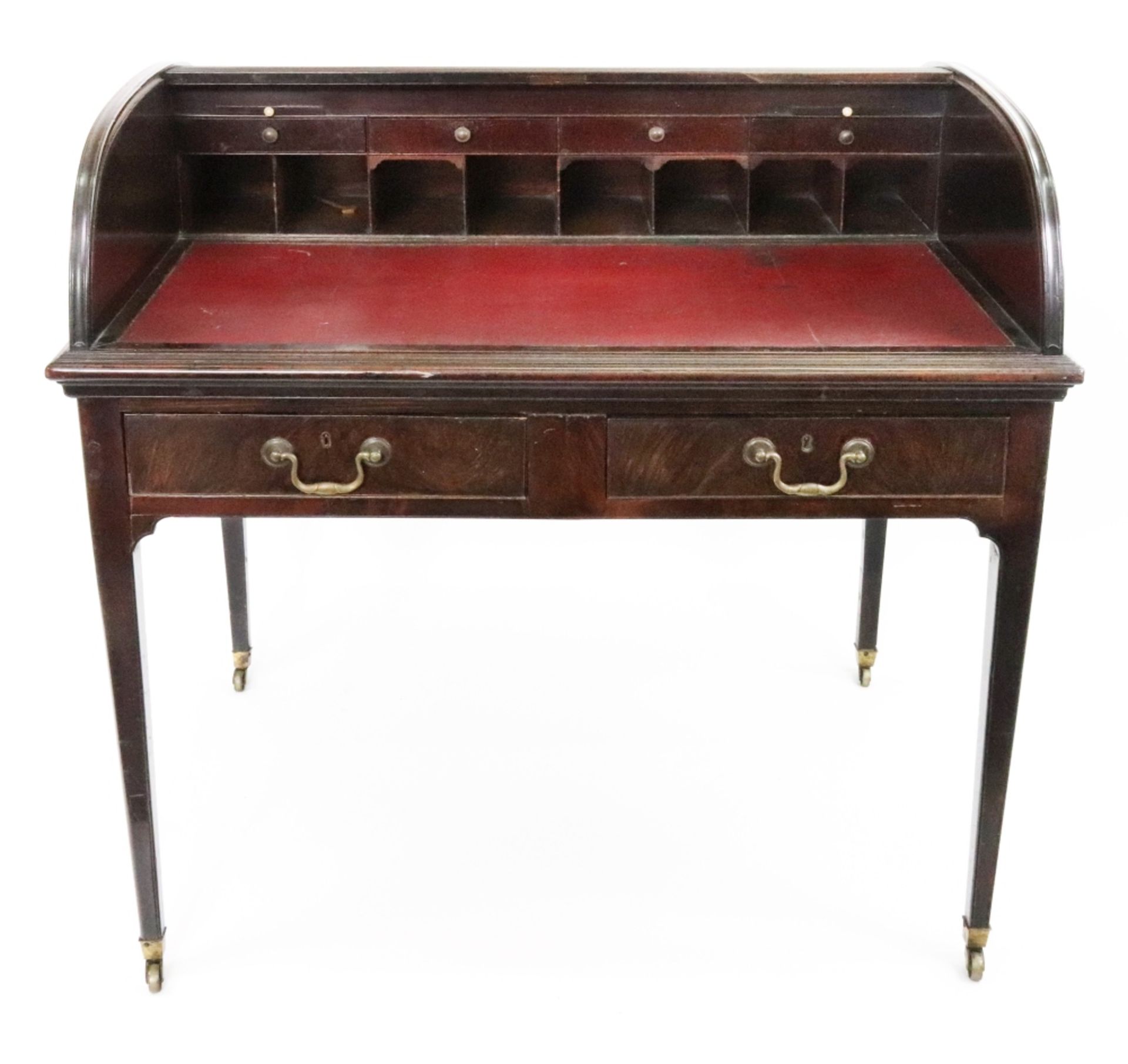 A George III mahogany tambor writing desk, the domed top shutter enclosing candle slides,