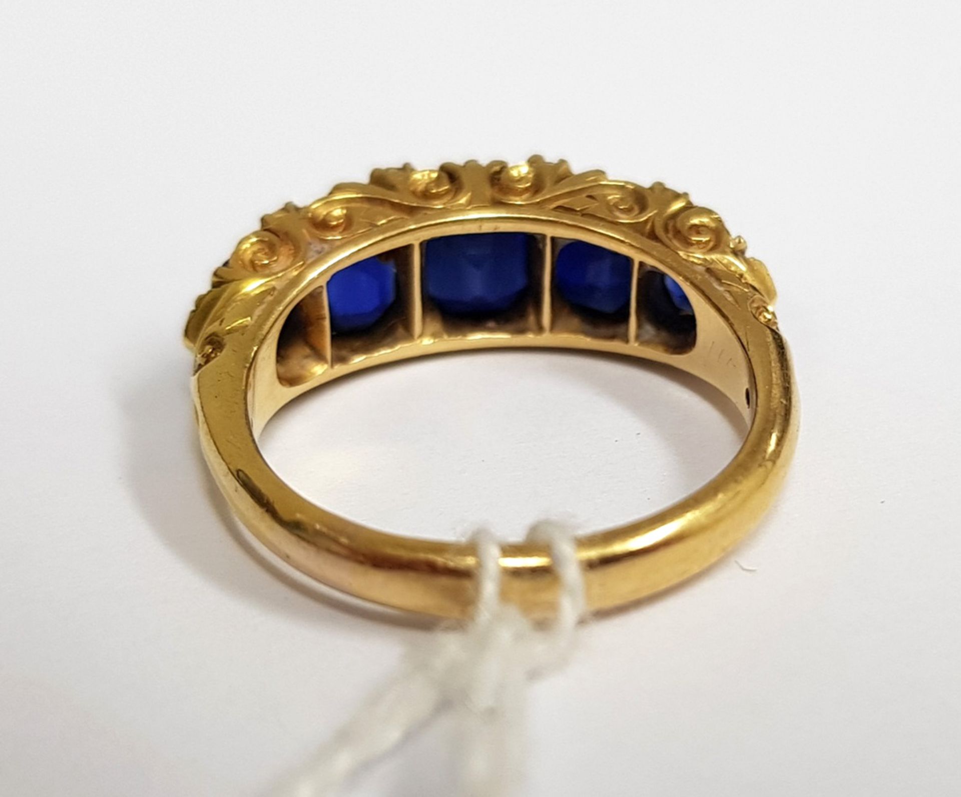 A late Victorian gold and sapphire five stone carved half-hoop ring with rose diamond points, - Image 3 of 5