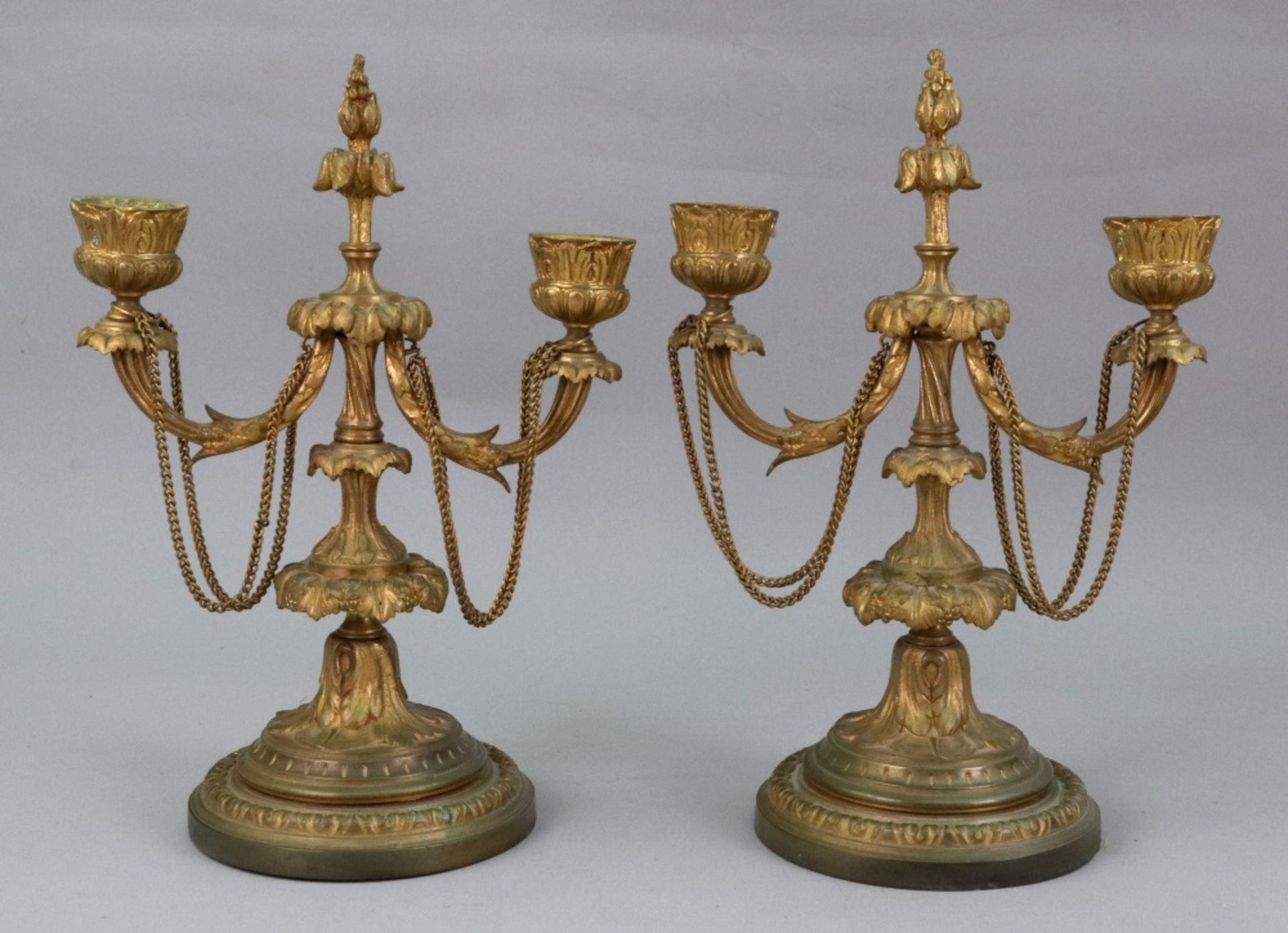 A pair of French gilt metal two light candelabrum, circa 1870, cast with acanthus,