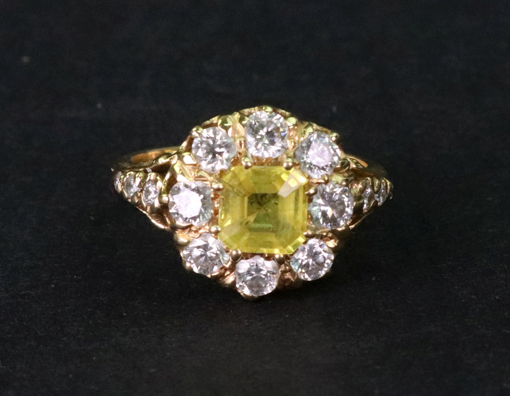 A modern yellow sapphire and diamond cluster ring,