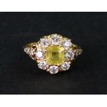 A modern yellow sapphire and diamond cluster ring,