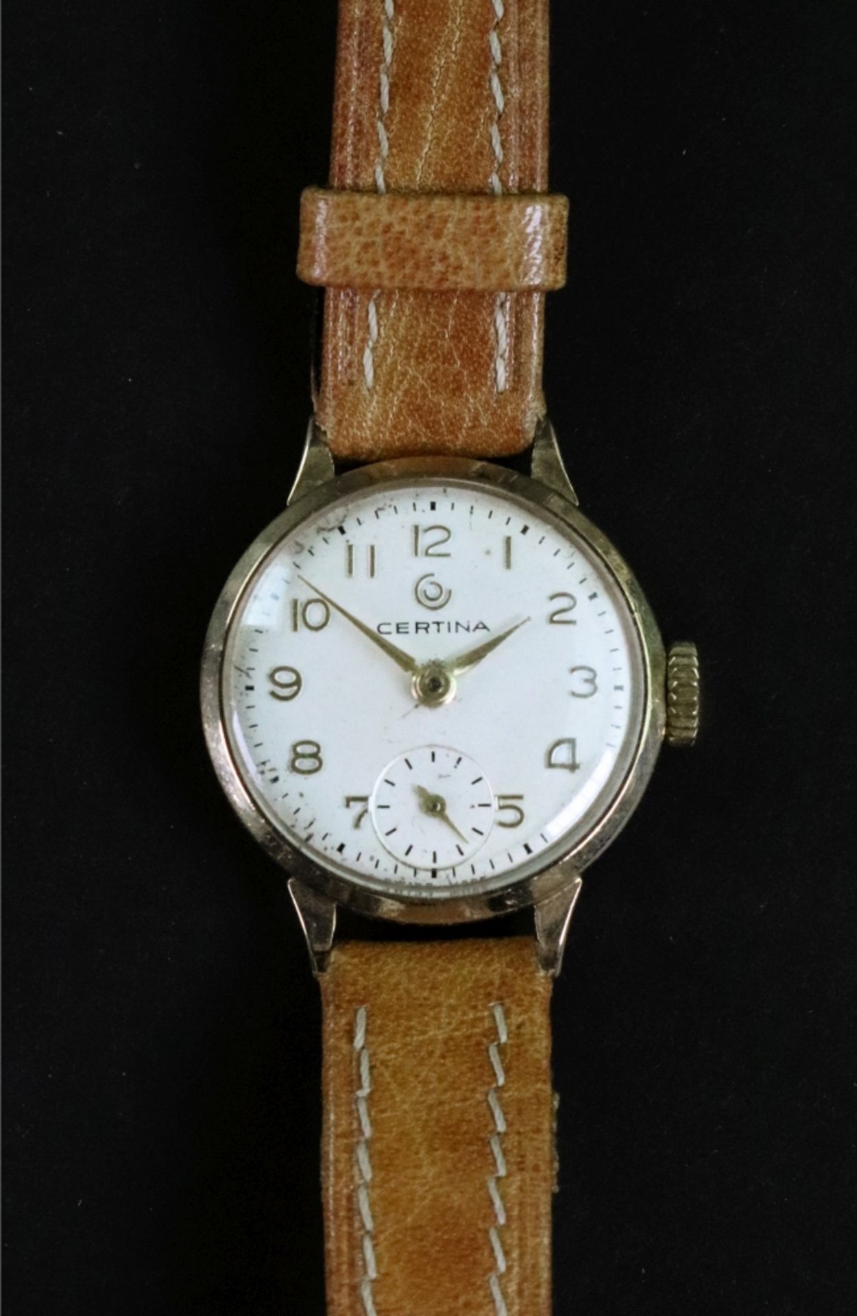 Certina; a lady's 9ct gold circular cased wrist watch.
