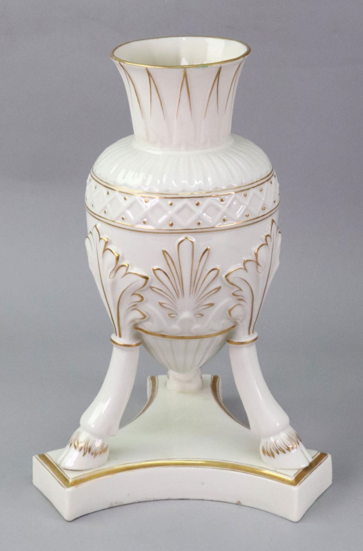 A Belleek cream glazed amphora, heightened with gilding,