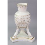 A Belleek cream glazed amphora, heightened with gilding,