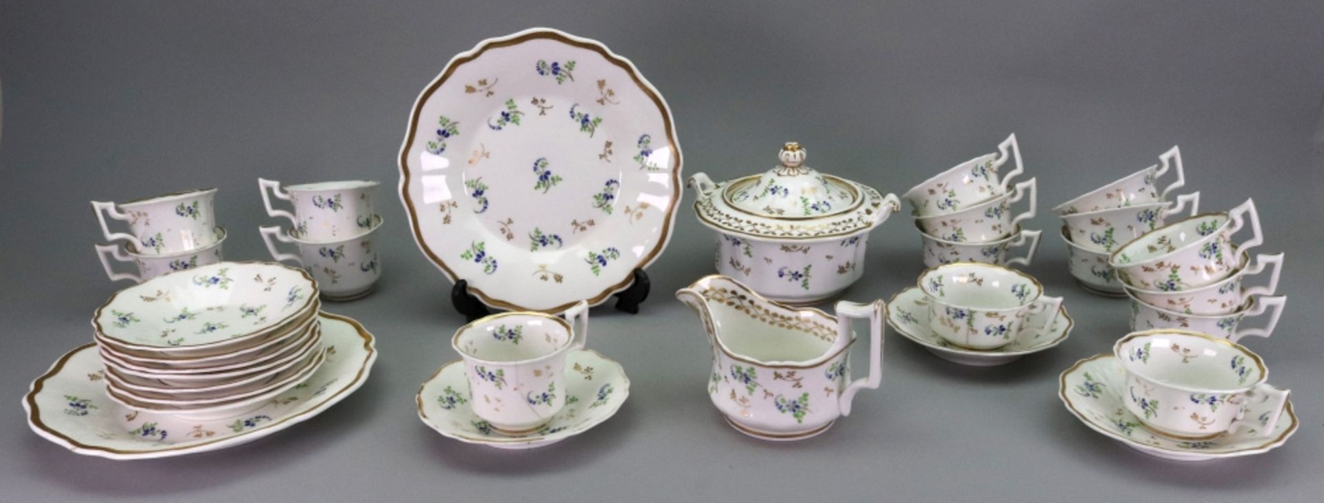 A Ridgway porcelain part tea and coffee service, 1820's, enamelled and gilt with flower sprigs,