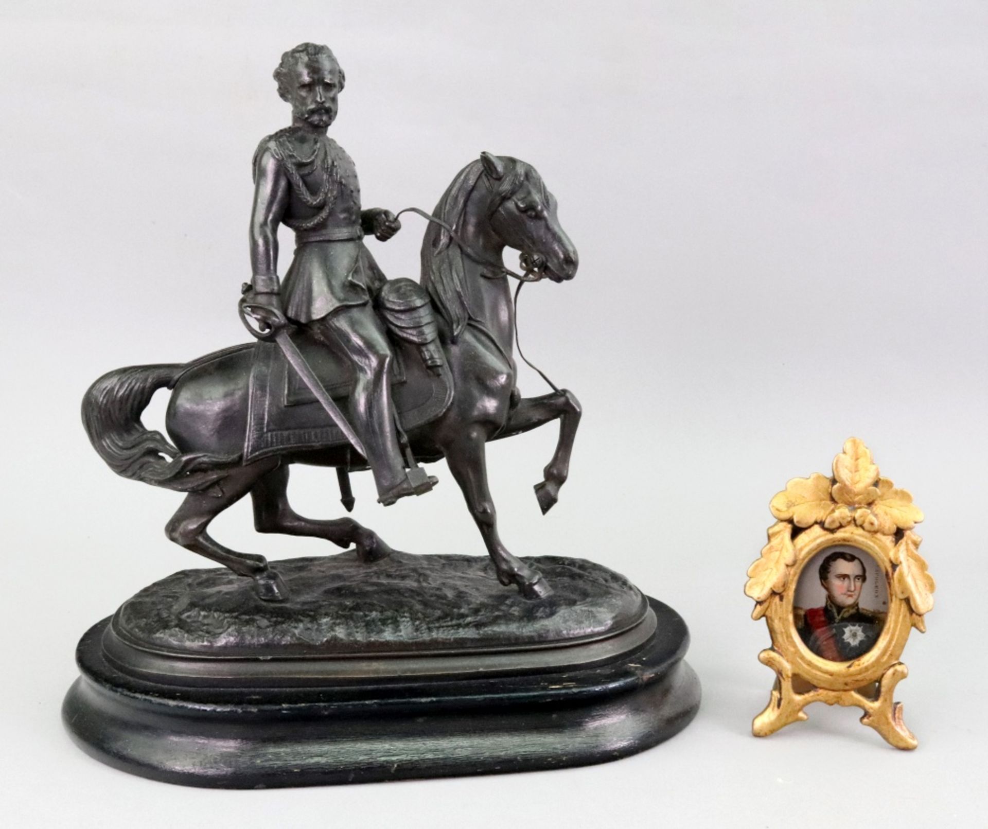 A Victorian bronzed speltar figure of a cavalry officer on horseback,