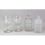 A pair of early 19th century square section glass decanters, diamond and split cut, side pouring,