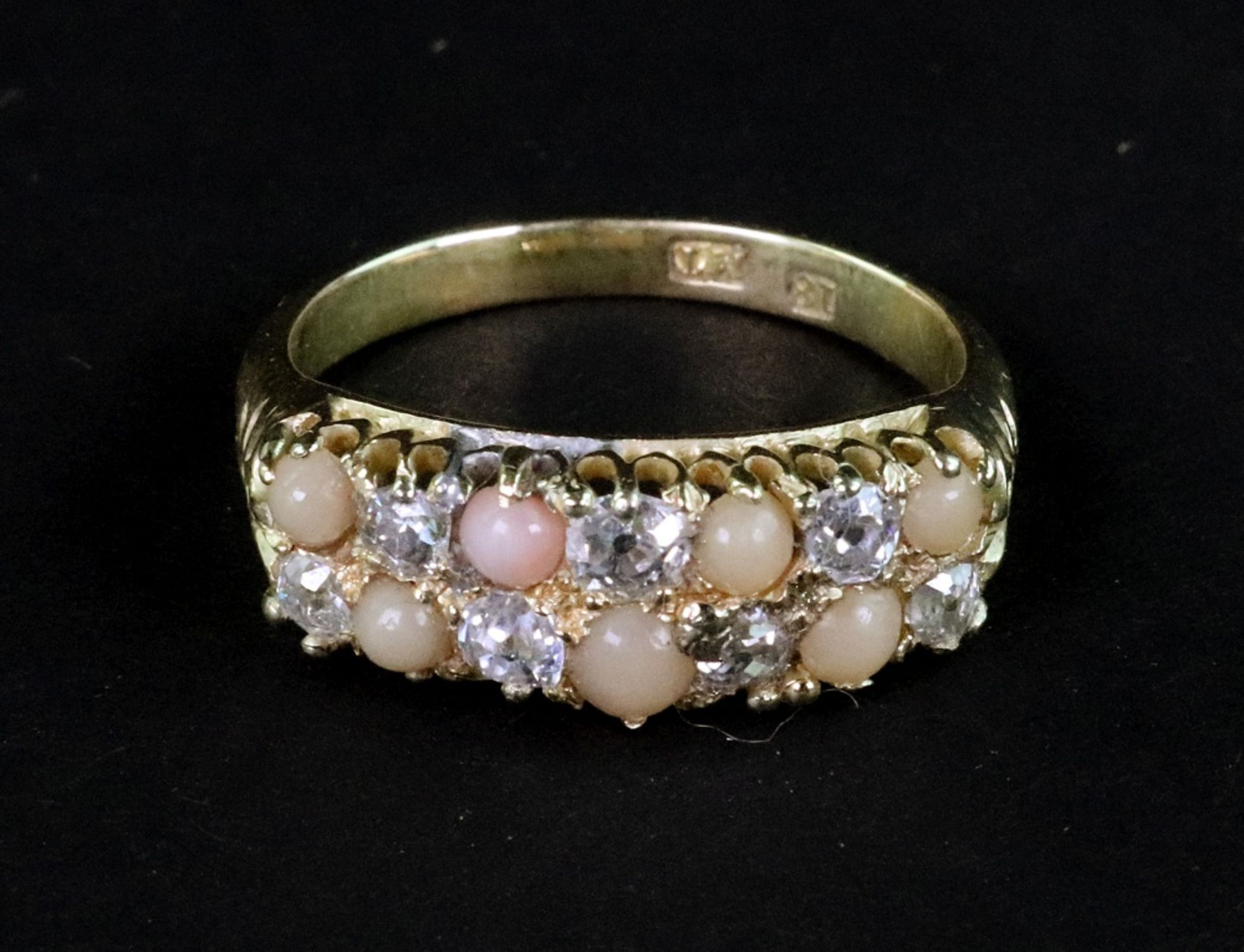 An early 20th century gold, diamond and coral 'chequer-board' ring,