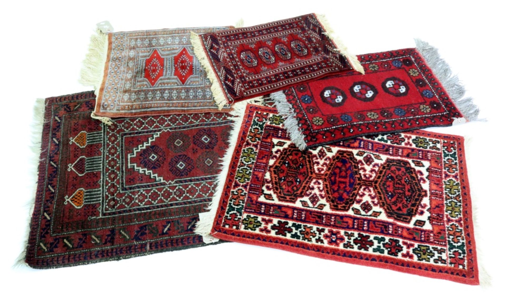 A Belouchi prayer rug, with mirab, on a rust ground, 127 x 82cm,