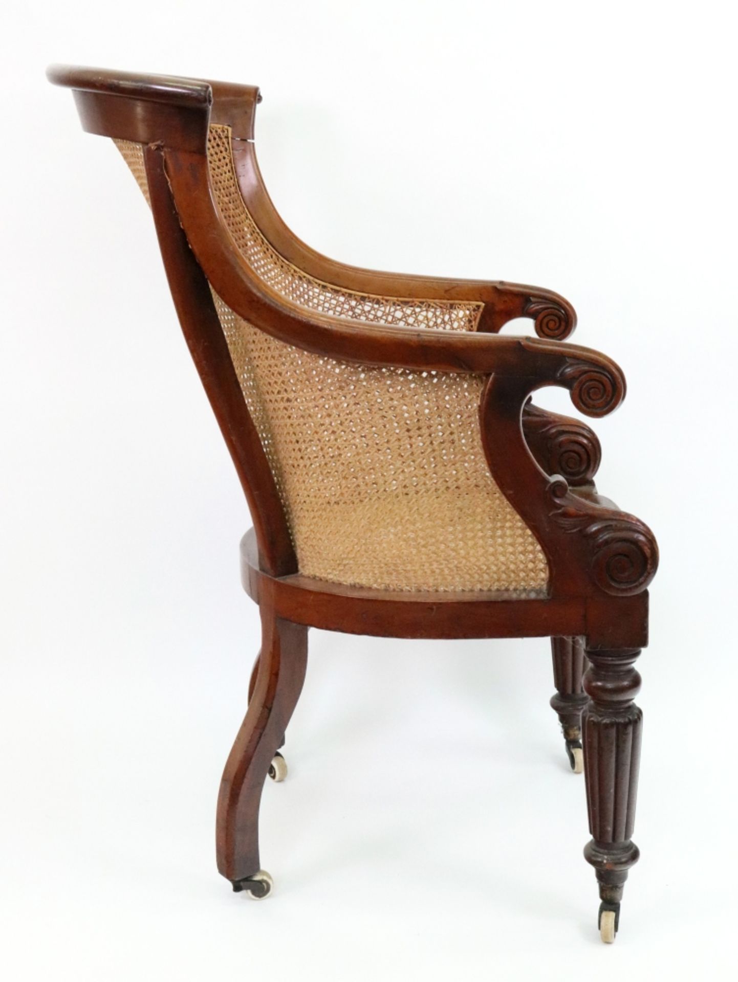 A pair of late Regency mahogany frame bergere chairs, with curved cane panel backs, sides and seats, - Image 3 of 3