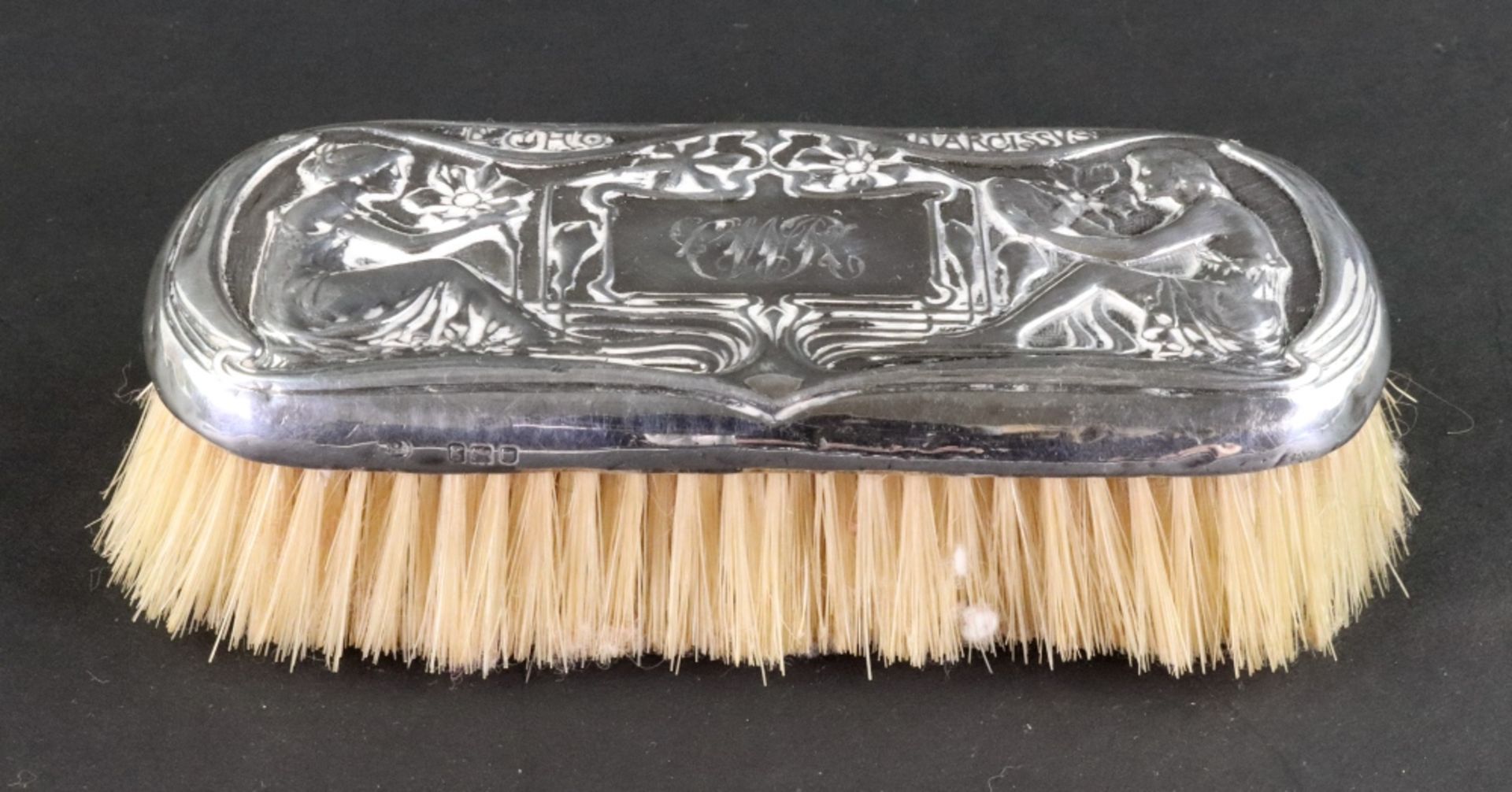 An Edwardian silver mounted clothes brush, London 1902,