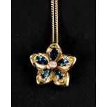 A Cloggau Welsh gold, blue topaz and diamond forget-me-not flower cluster pendant,
